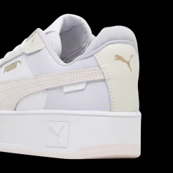 Sneakers platform casual da donna bianche con dettagli rosa e logo Puma Carina Street