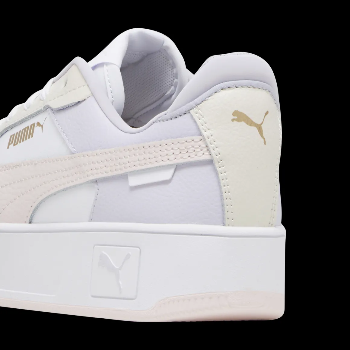 Sneakers platform casual da donna bianche con dettagli rosa e logo Puma Carina Street